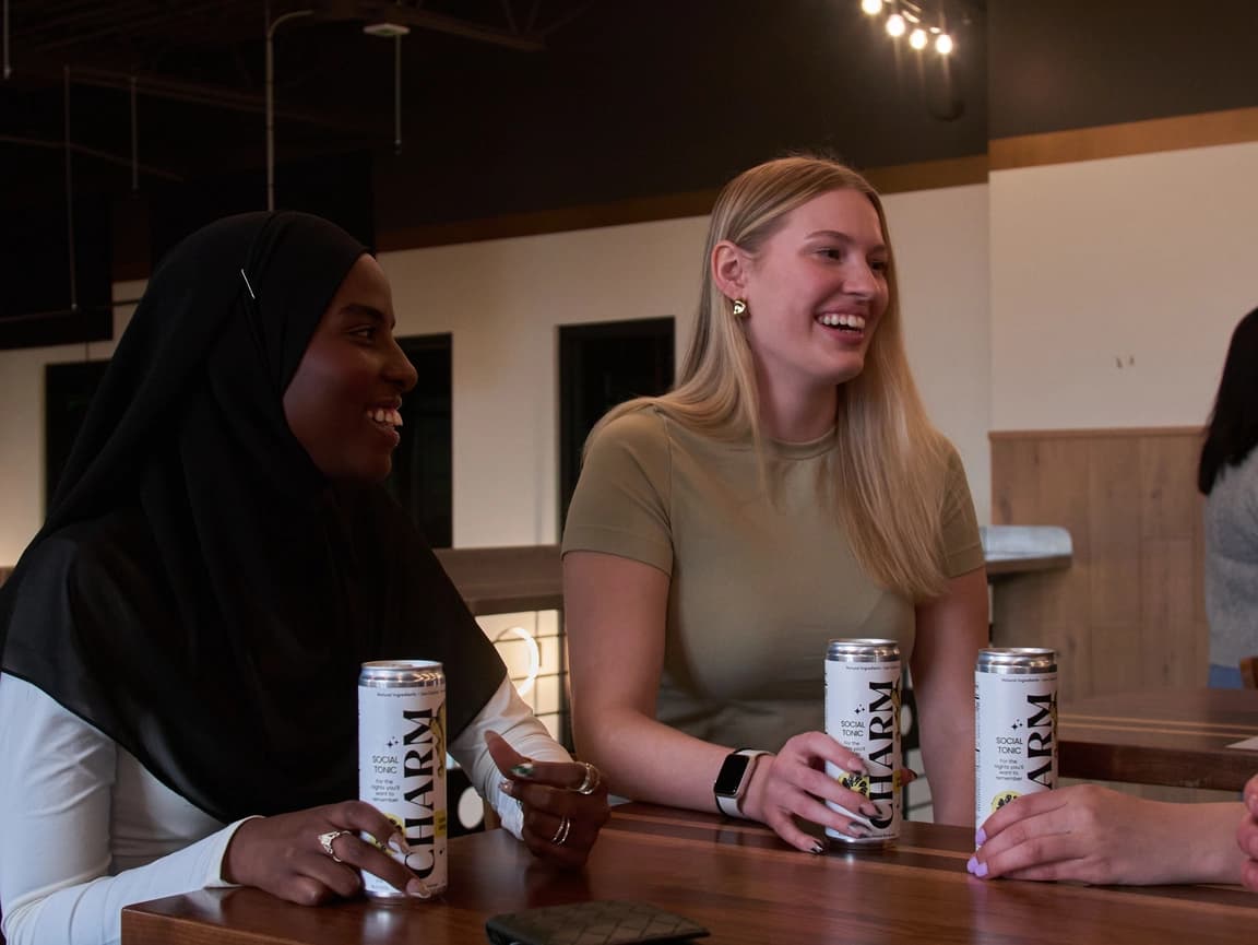 People enjoying Charm at a table